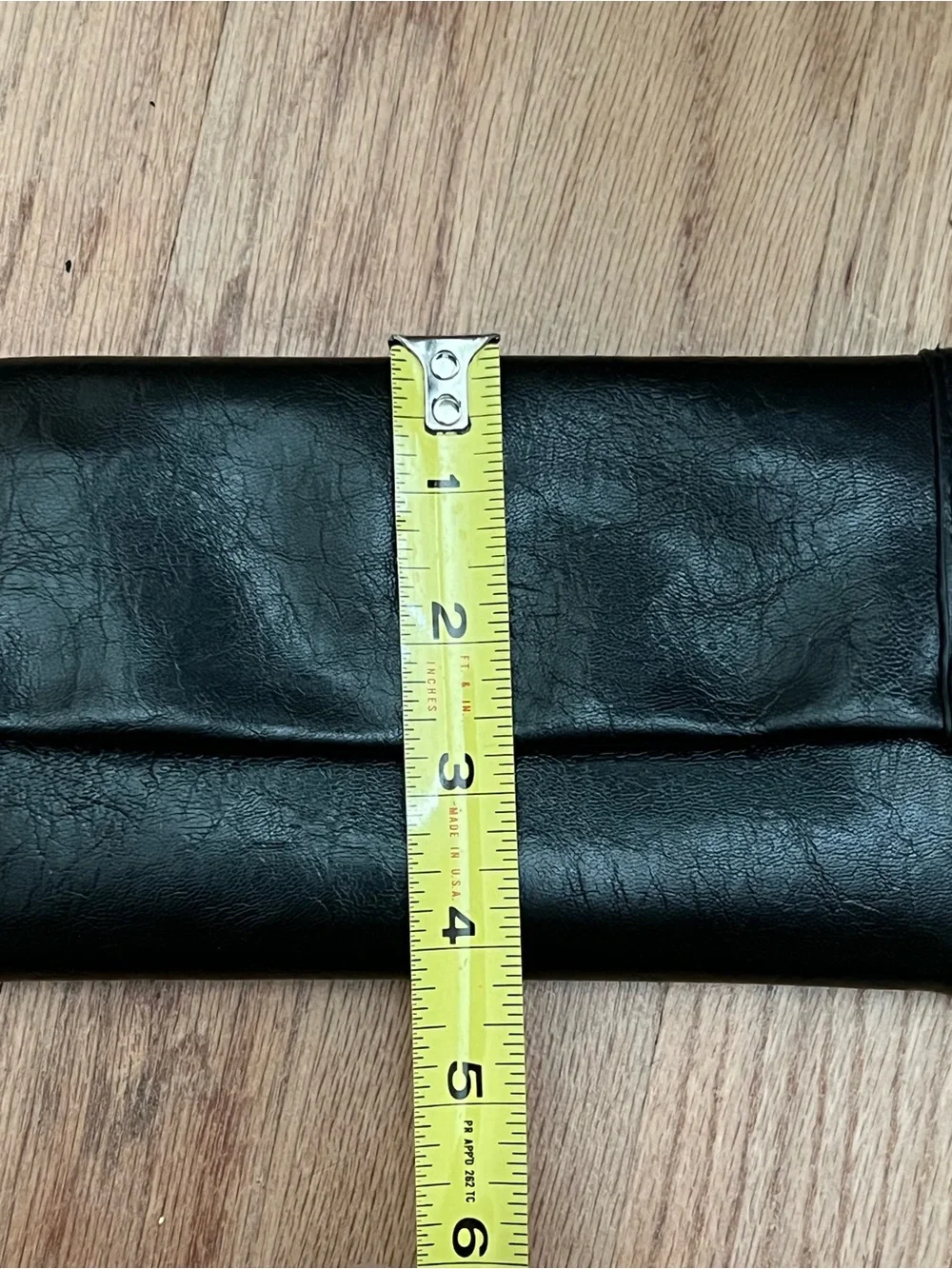 Black Fold-Over Clutch Wallet new without tags. Never used. Genuine leather